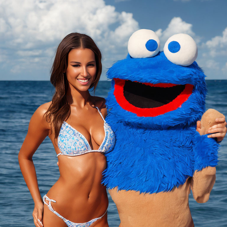 Woman in Blue Bikini Poses with Cookie Monster Costume at Ocean