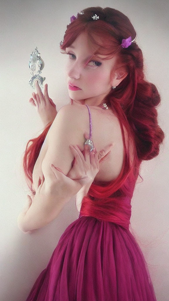 Red-haired woman in purple dress with flower hair accessory looking at hand mirror