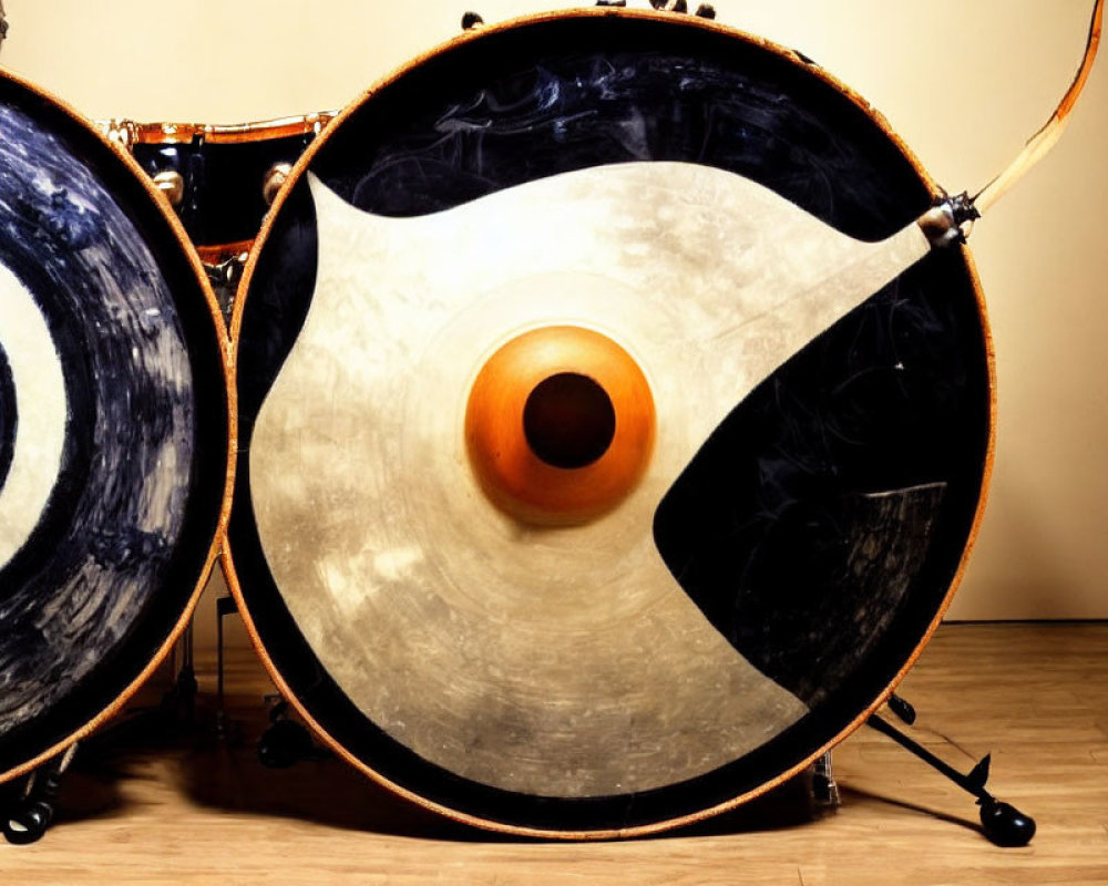 Large Bass Drums with Blue and Black Circular Patterns on Wood Floor
