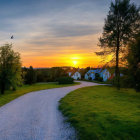 Scenic sunset golf course with winding path, green grass, trees