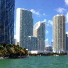 Modern skyscrapers and palm trees in tropical waterfront scene
