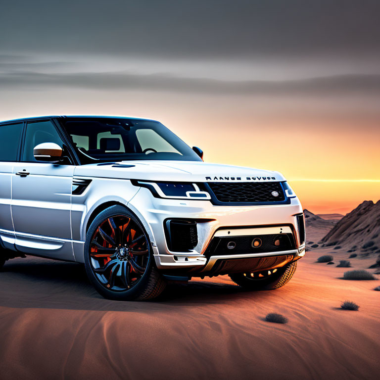 White Range Rover parked in sandy desert at sunset