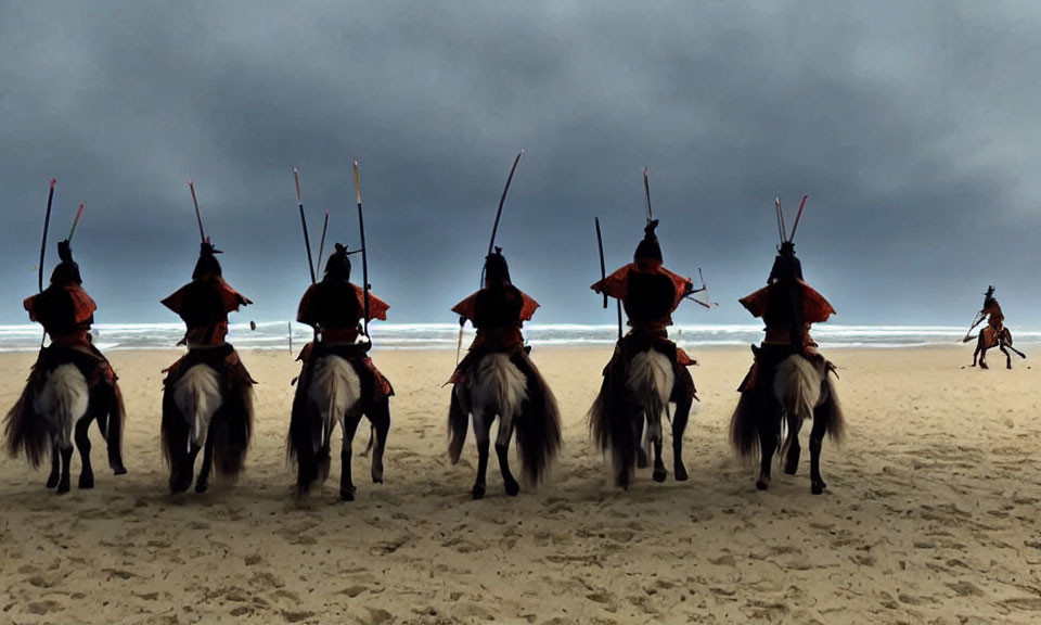 Group of individuals in red traditional attire riding horses on a beach under a cloudy sky, some holding spe