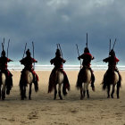 Group of individuals in red traditional attire riding horses on a beach under a cloudy sky, some holding spe