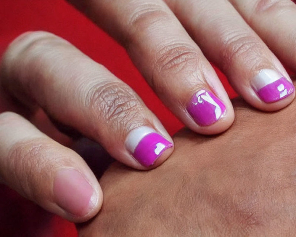 Detailed Close-up of Purple and White French Tip Manicured Nails