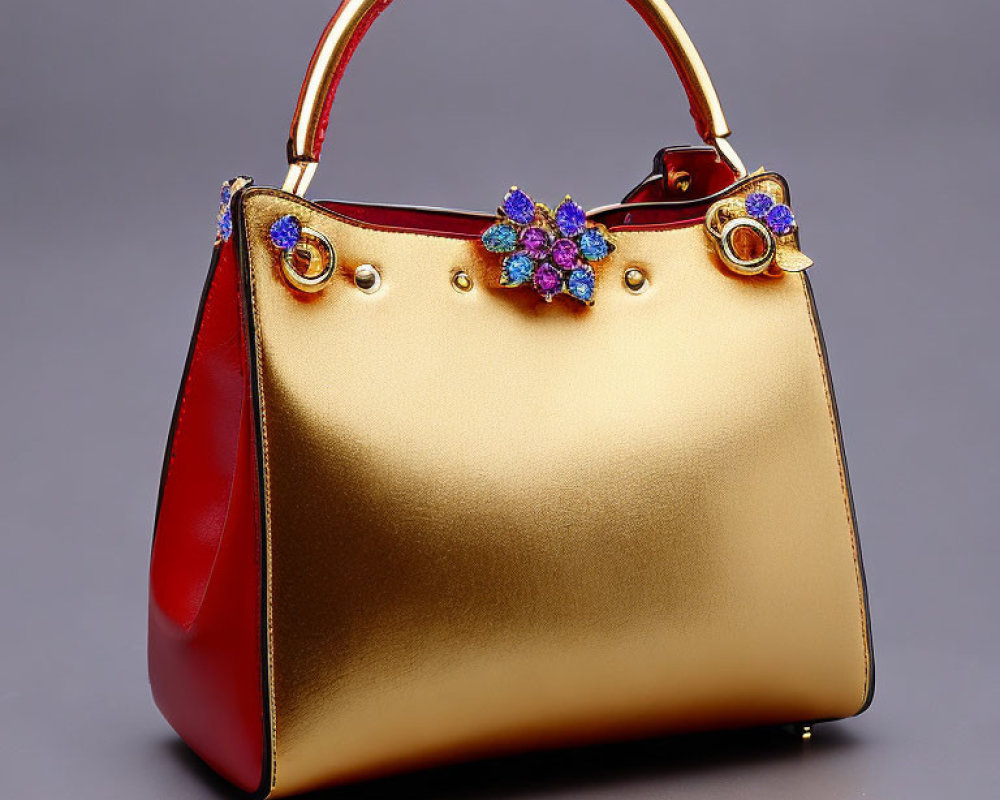 Gold-to-Red Gradient Handbag with Floral Brooch and Circular Handles on Grey Background