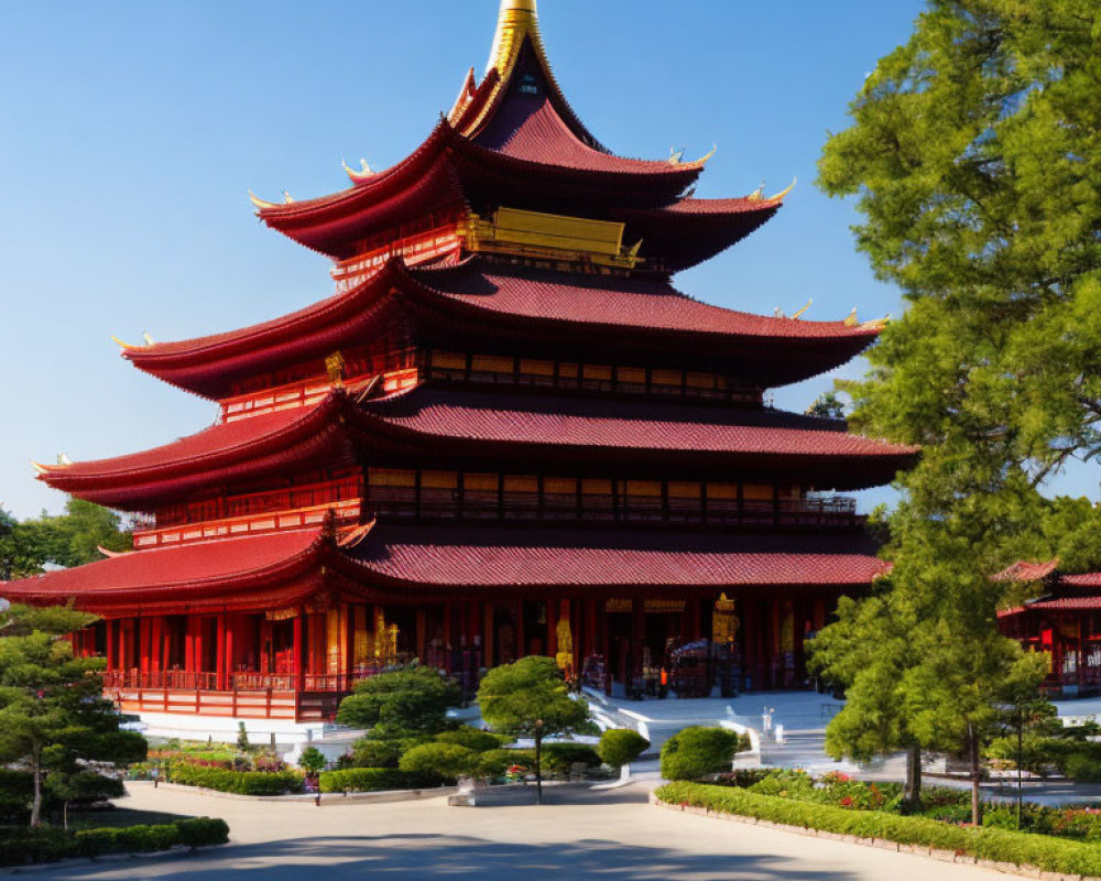 Traditional Red and Gold Pagoda Amid Green Trees and Blue Sky