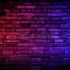 Woman's face under neon lights with purple streaks: a digital, futuristic close-up
