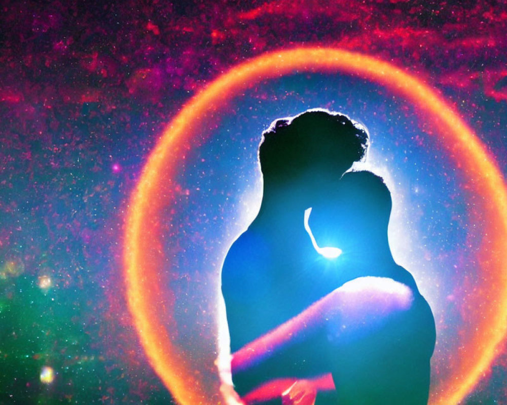 Silhouette of embracing couple against vibrant cosmic background