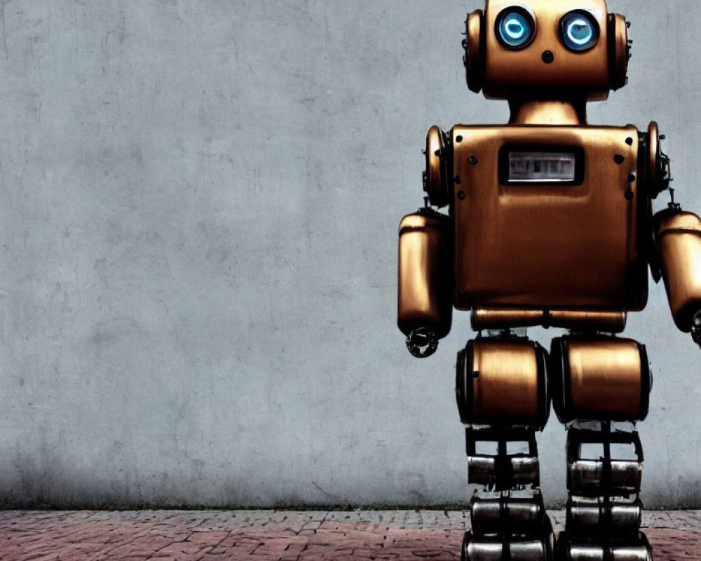 Golden retro robot with blue eyes on grey wall background