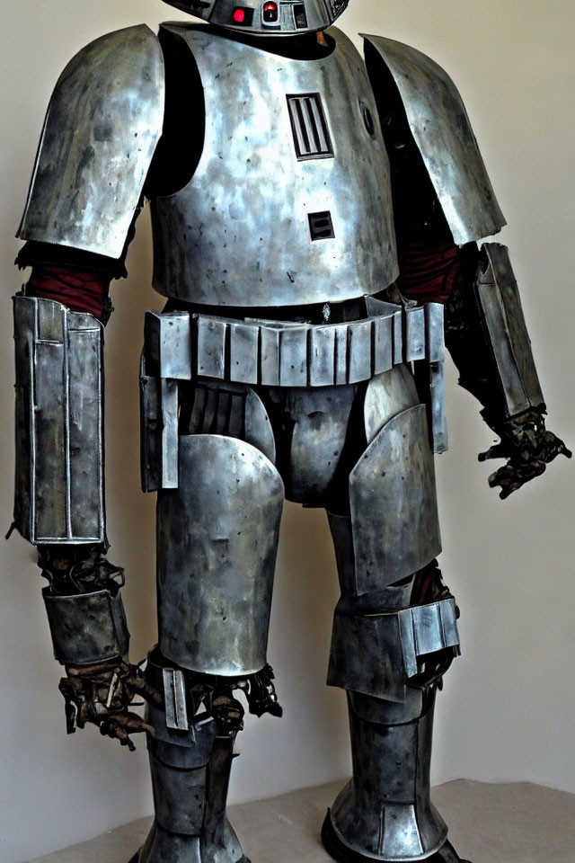 Metal suit of armor with humanoid features and robotic elements