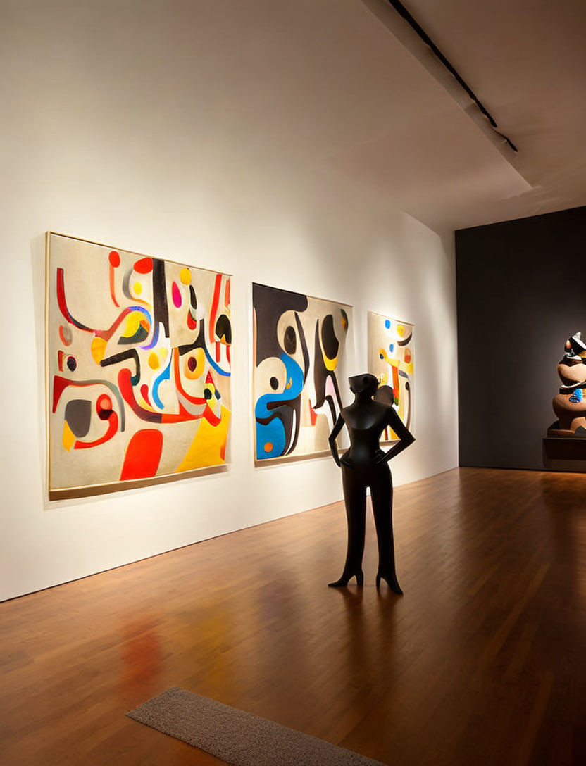 Abstract paintings adorn art gallery interior with observer silhouette