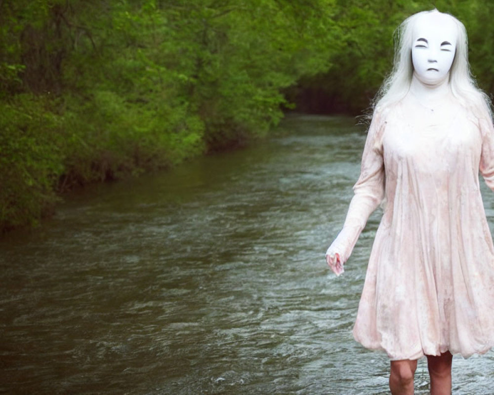 Person in Pink Dress with White Mask by Forest Stream