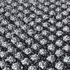 Monochrome image of checkered round objects in dense field