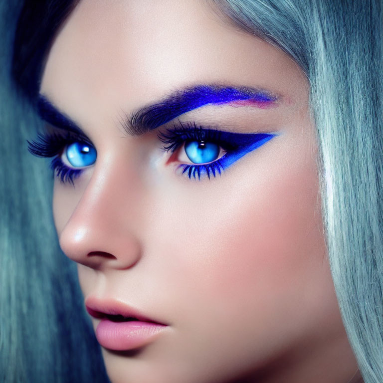 Person with Striking Blue Eyes, Blue and Purple Eyeshadow, Silver Hair