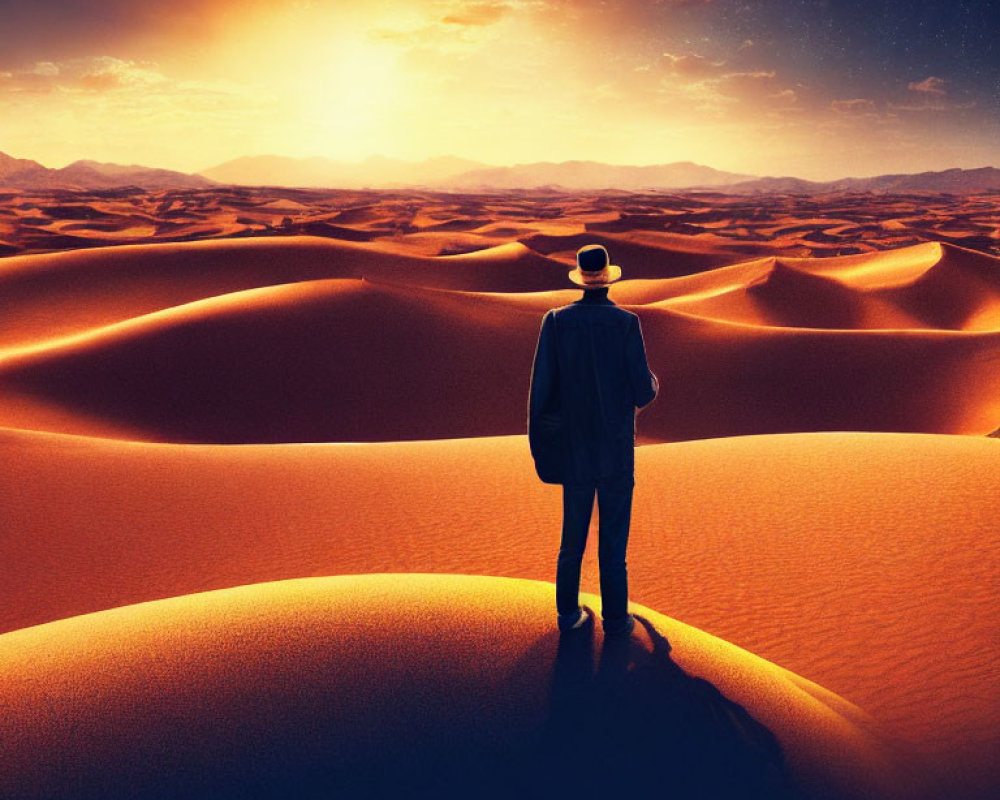 Businessperson in suit and hat watching sunset over desert dunes