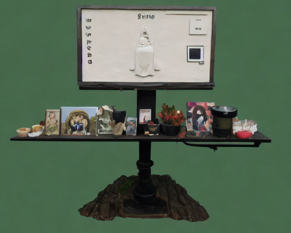 Shrine-themed art installation with central figurine on shelf against green background