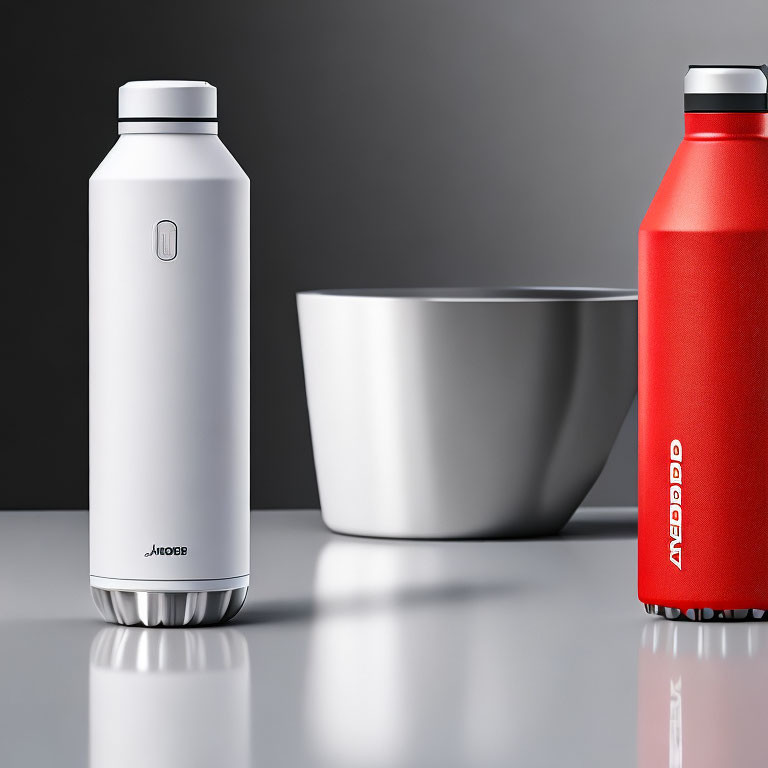 Modern Insulated Bottles in White and Red Next to White Bowl on Reflective Surface