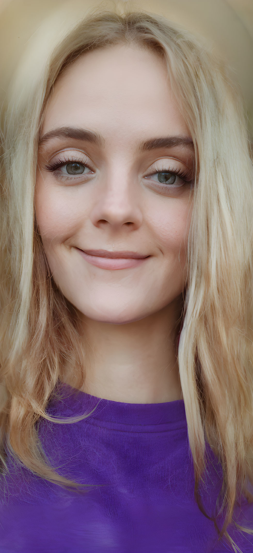 Blonde Woman in Purple Top Smiling with Blue Eyes
