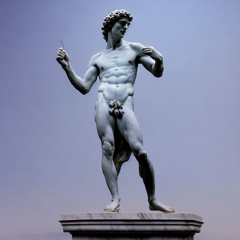 Detailed marble statue of David with sling against pale sky