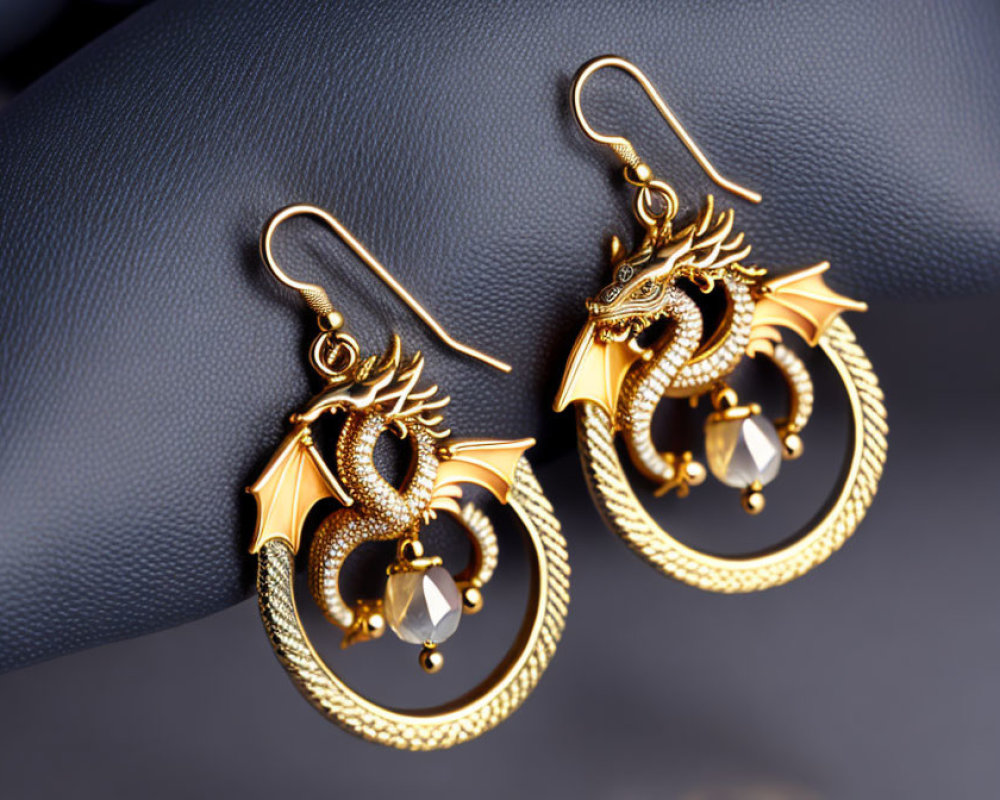 Intricate Gold Dragon Earrings with Dangling Crystal