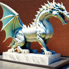 Majestic dragon sculpture with extended wings on marble pedestal in orange room