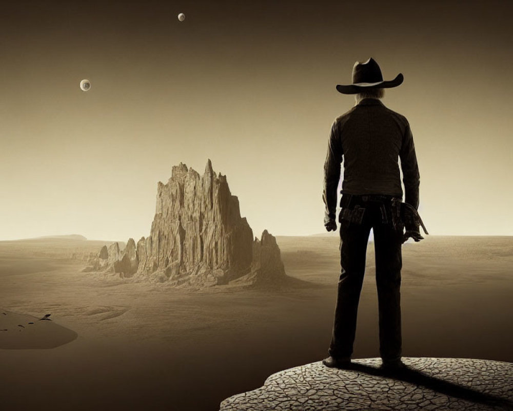 Silhouette of cowboy on cracked desert ground with rock formation and two moons