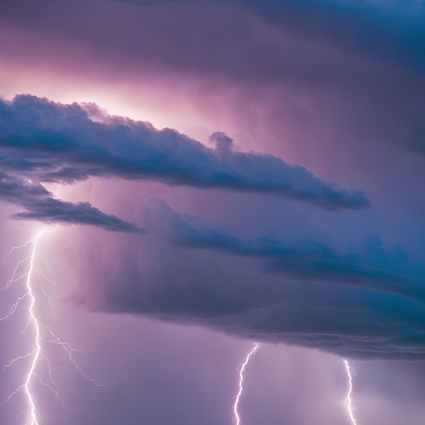 Intense lightning bolts in purple thunderstorm