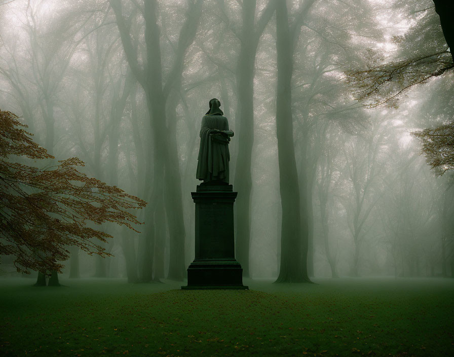 Solemn statue in misty forest landscape with towering trees