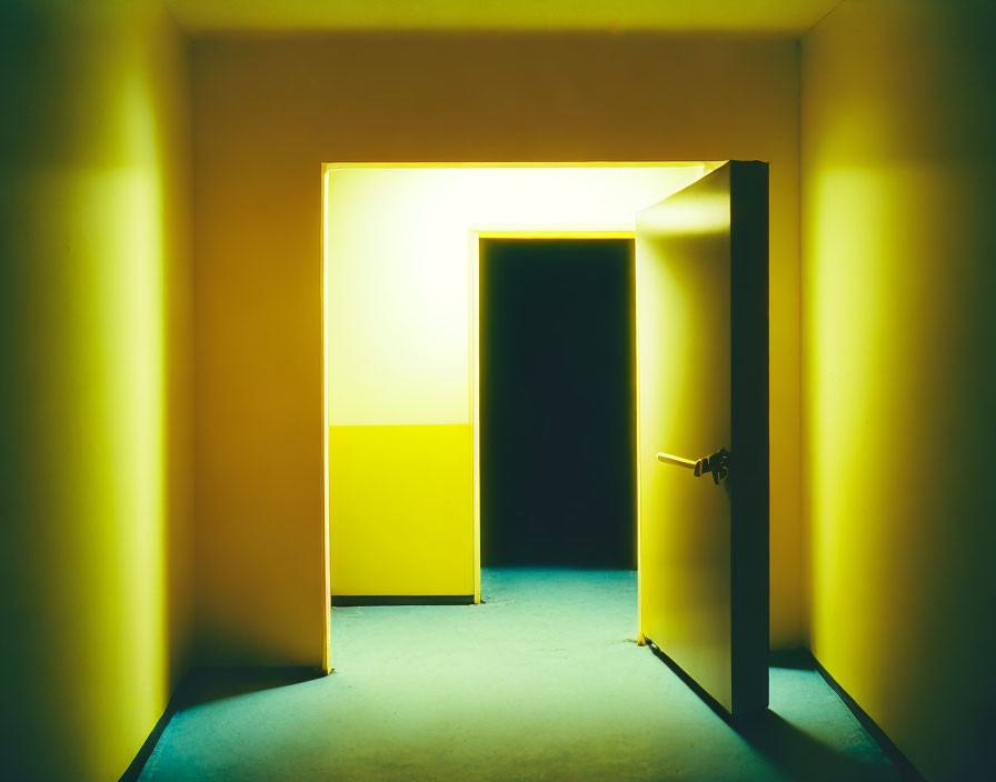 Dimly Lit Corridor with Yellow Walls and Bright Yellow Door Frame