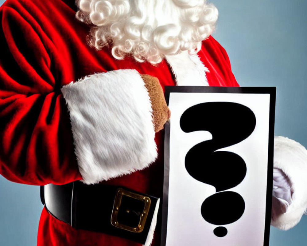 Santa Claus costume person holding question mark sign on blue background