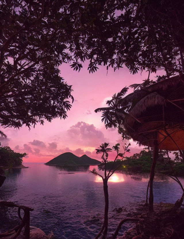 Tranquil dusk landscape with pink-purple sky, island, foliage, and hut.