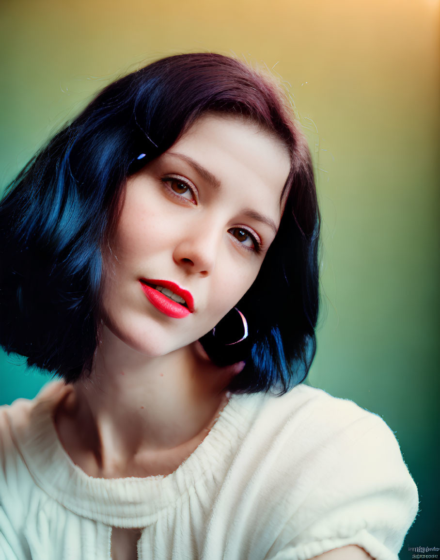 Portrait of Woman with Short Blue Hair and Red Lipstick in White Top and Hoop Earrings on