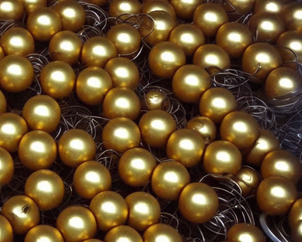 Shiny golden eggs in neat arrangement with metallic luster and glossy reflections