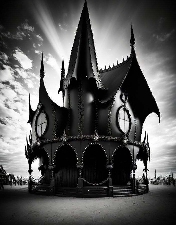 Monochromatic whimsical gothic-style carousel under cloudy sky