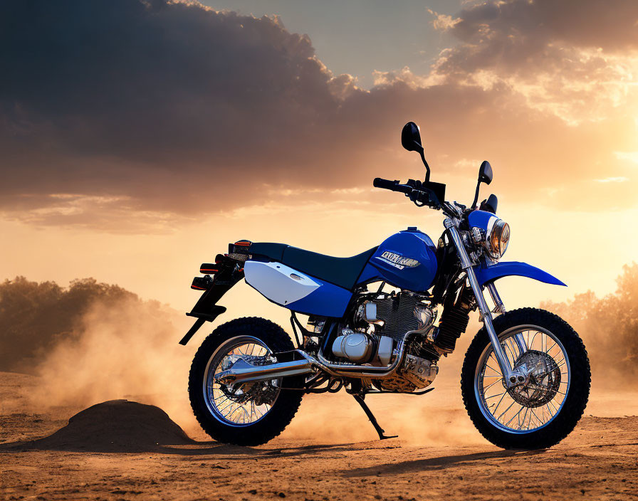 Blue Off-Road Motorcycle on Sandy Terrain at Sunset