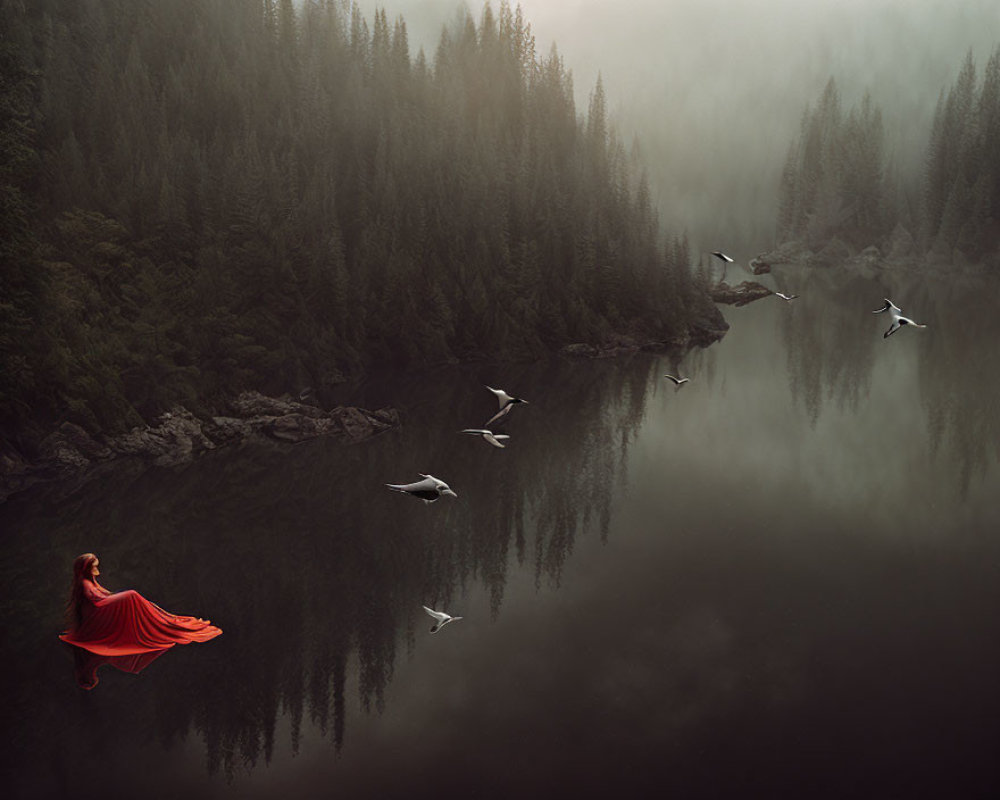 Tranquil lake scene with woman in red dress by misty forest