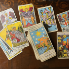 Botanical Illustration Tarot Cards on Table with Leaves
