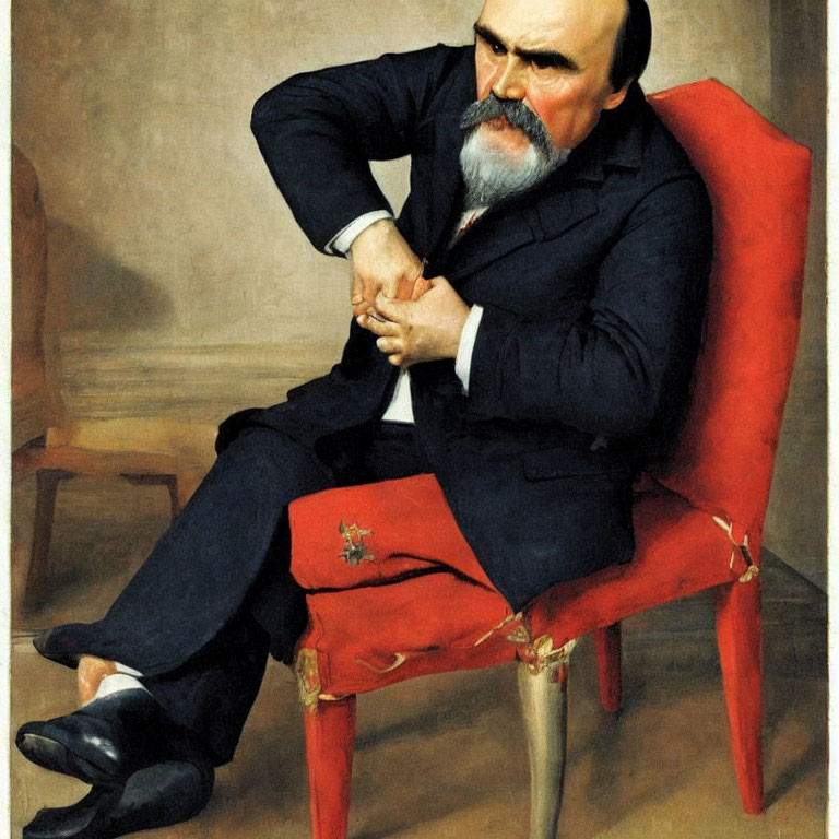 Portrait of Bearded Man in Red Chair with Crossed Arms