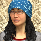 Smiling woman with glasses and blue beanie on gold background