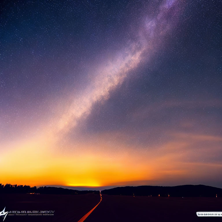 Starry Milky Way over sunset gradient with road in night sky