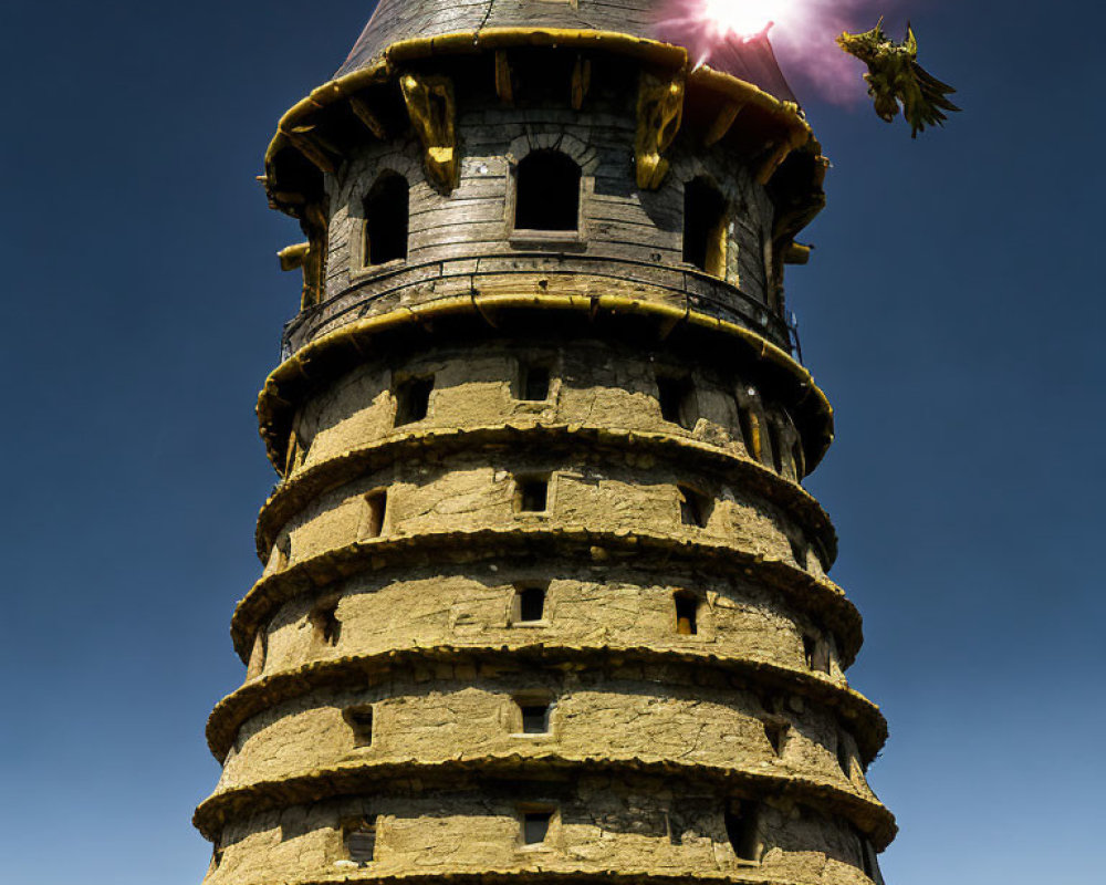 Stone spiral tower with dragon and sun in clear blue sky