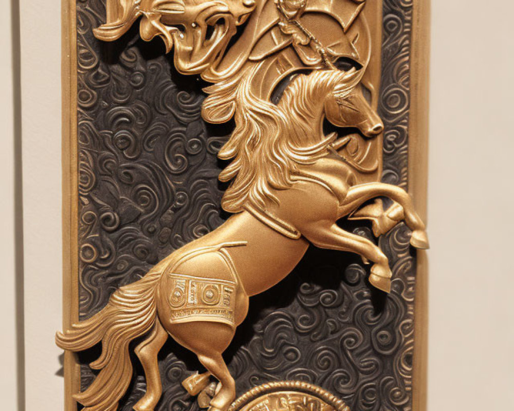 Golden relief panel of rearing horse with intricate patterns on dark background