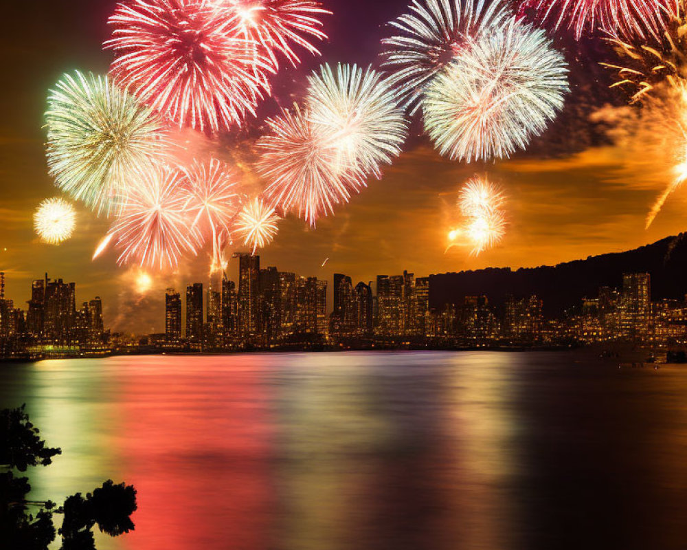 Colorful fireworks illuminate city skyline at night