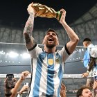 Animated soccer player celebrates victory with trophy in stadium full of fans