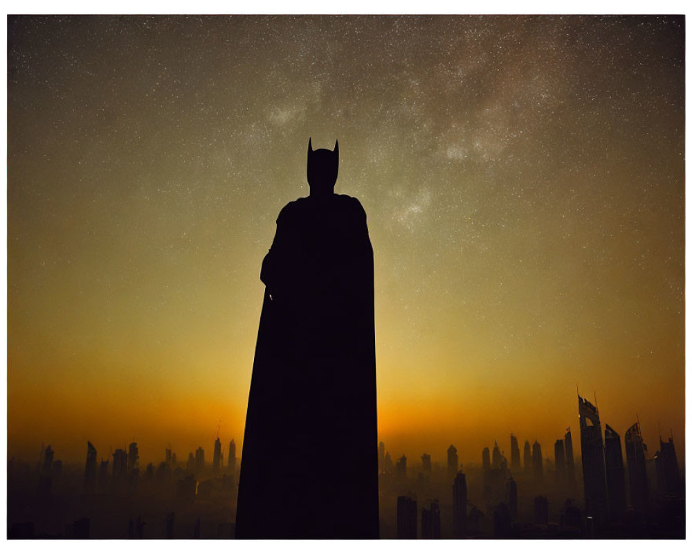 Person in Batman costume silhouette against city skyline under starry night.