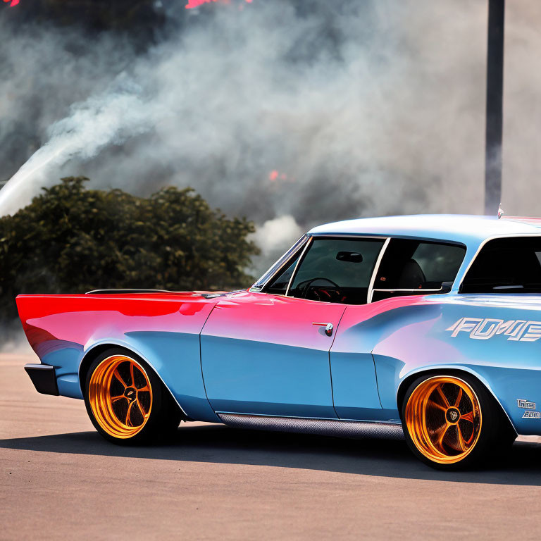 Blue and Pink Classic Car with Orange Wheels Burning Out in Smoke