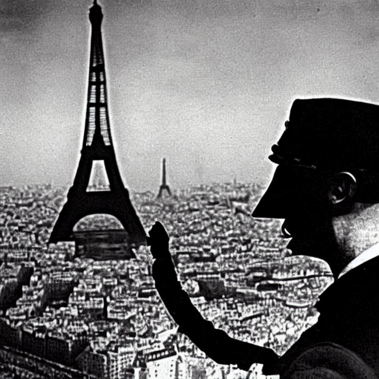 Man's Silhouette Holding Eiffel Tower in Paris Profile Shot