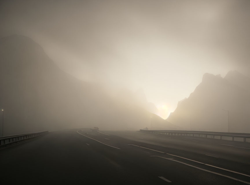 Foggy road with vehicles, mountain silhouettes, and subdued sunrise