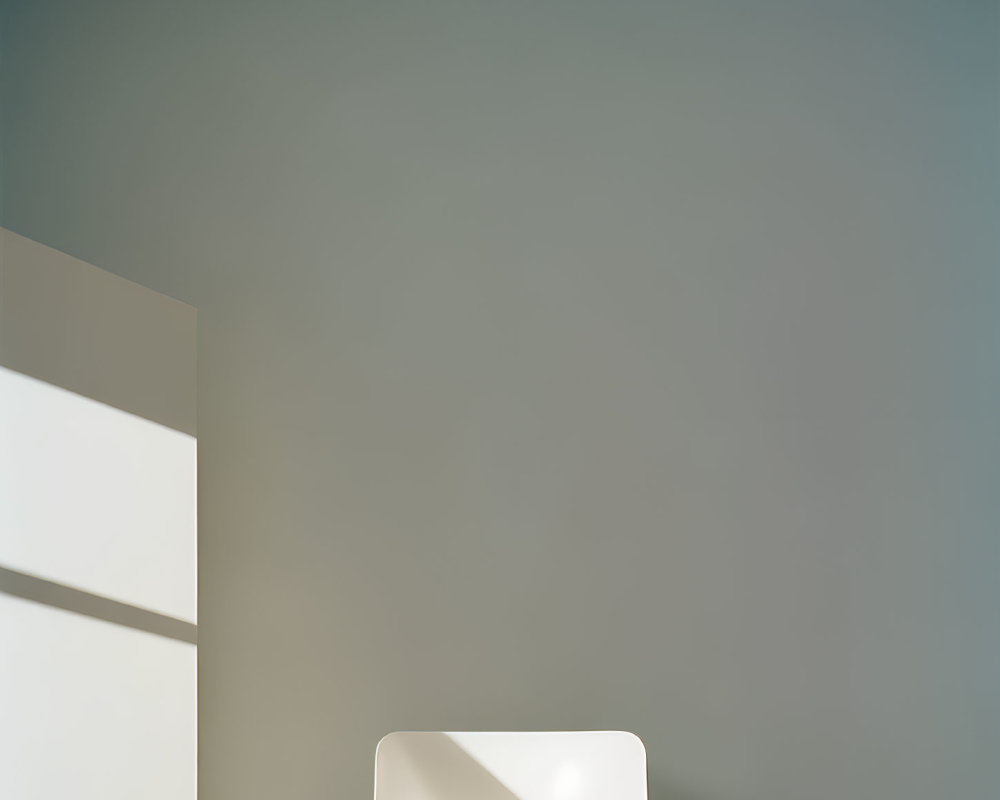 Minimalist White Modern Chair in Illuminated Interior